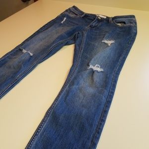 Light blue distressed skinny jeans.